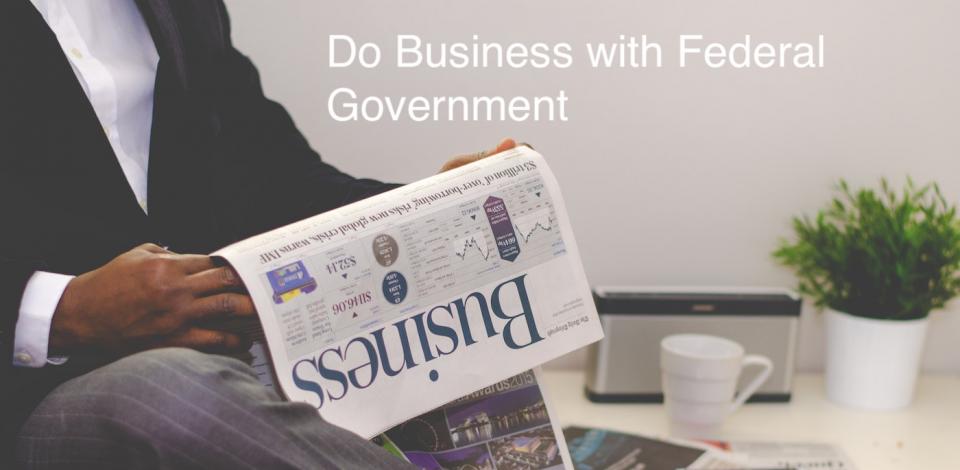 Man with newspaper and Do business with federal governments text